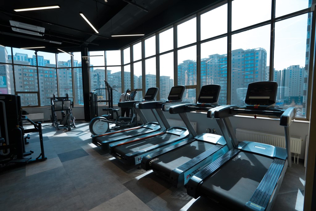 High-end fitness treadmill with a digital display in a modern gym